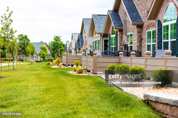 groups of of townhouses with healthy green yards on a sunny summer day - missouri stock pictures, royalty-free photos & images