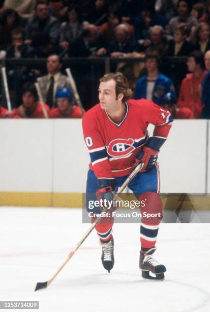 Guy Lafleur of the Montreal Canadiens skates against the New York Rangers during an NHL Hockey game circa 1979 at Madison Square Garden in the...