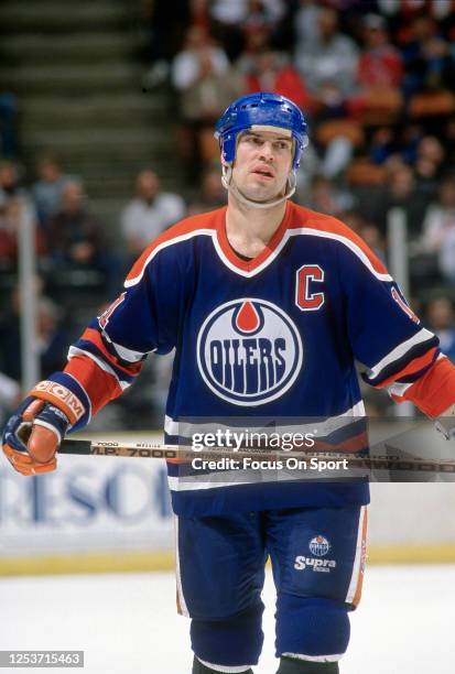 Mark Messier of the Edmonton Oilers looks on against the New Jersey Devils during an NHL Hockey game circa 1991 at the Brendan Byrne Arena in East...