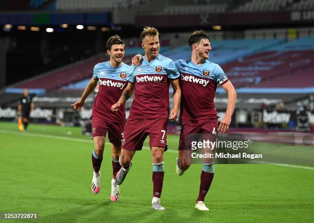 Andriy Yarmolenko of West Ham United celebrates after scoring his team's third goal with team mates during the Premier League match between West Ham...