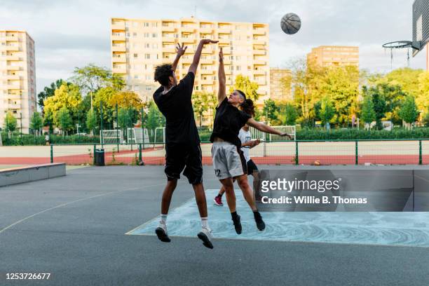 woman jumping to block a shot - blocking sports activity stock pictures, royalty-free photos & images
