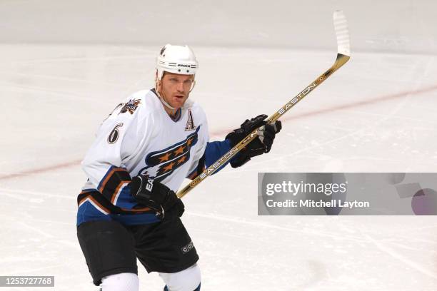 Calle Johansson of the Tampa Bay Lighting looks on during a NHL hockey game against the Tampa Bay a Lighting at MCI Center on December 23, 2002 in...