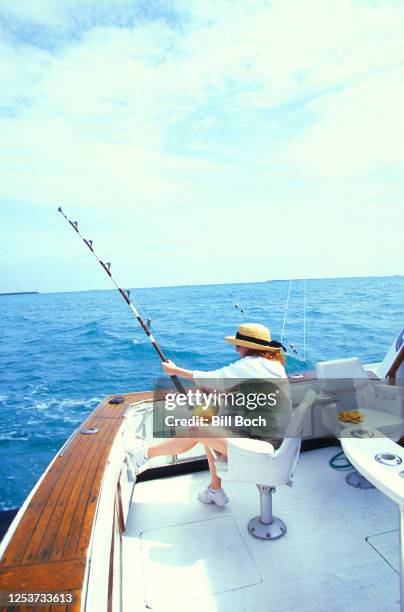 young woman big game fishing on a chartered fishing boat in key west florida - catching food stock pictures, royalty-free photos & images