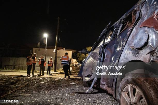 Destroyed car is seen after the Palestinian factions fired barrages of rockets into Israel on Wednesday amid tension following Israeli airstrikes on...