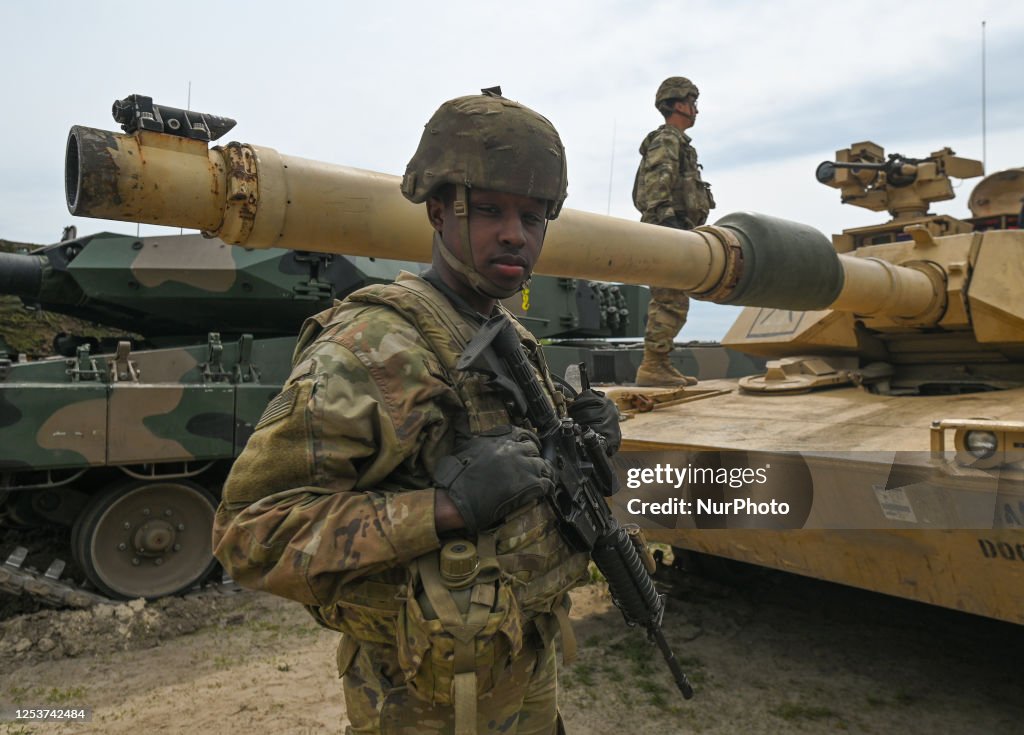 Red Multi Soldier Course American soldiers are seen during a high-intensity training session ...