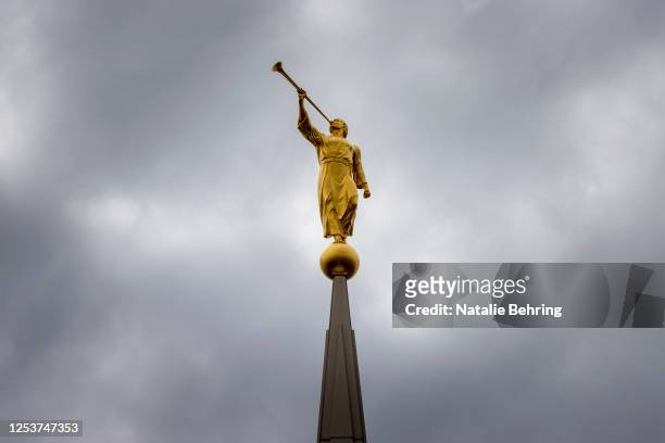 Golden sculpture of an angel "Moroni" is seen atop the Temple of the Church of Jesus Christ of Latter Day Saints on May 10, 2023 in Rexburg, Idaho....