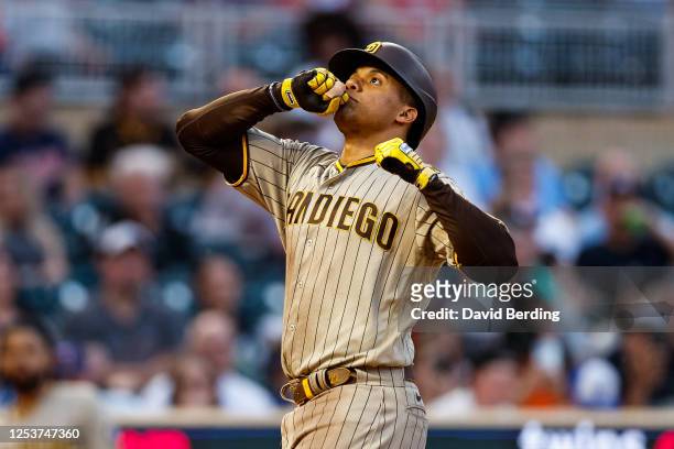 Juan Soto of the San Diego Padres celebrates his solo home run as he crosses home plate against the Minnesota Twins in the seventh inning at Target...