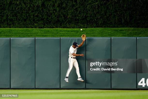 Michael A. Taylor of the Minnesota Twins jumps but can't catch a ball hit by Juan Soto of the San Diego Padres for a solo home run in the seventh...