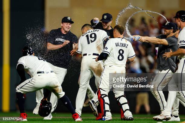 Alex Kirilloff of the Minnesota Twins celebrates his walk off RBI single against the San Diego Padres with teammates after the game at Target Field...