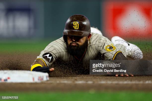 Rougned Odor of the San Diego Padres slides into second base on a sacrifice fly against the Minnesota Twins in the tenth inning at Target Field on...