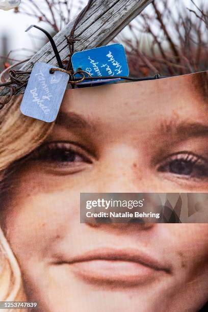 Banner showing the face of Tylee Ryan is seen on a fence set up as a memorial near where her body was found on May 10, 2023 in Rexburg, Idaho. Lori...