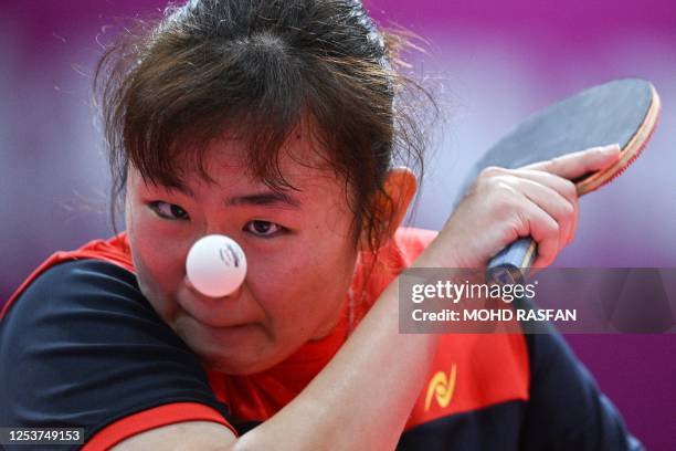 Malaysia's Alice Chang hits a shot during her match against Thailand's Orawan Paranang in the women's table tennis team final at the 32nd Southeast...
