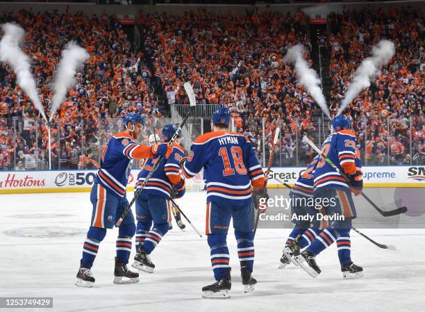 Evan Bouchard of the Edmonton Oilers celebrates after his first period goal against the Vegas Golden Knights with Connor McDavid, Zach Hyman, Leon...