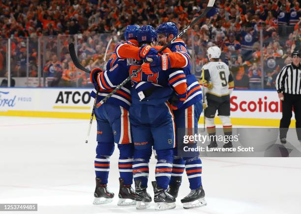 Ryan Nugent-Hopkins of the Edmonton Oilers celebrates a goal with his teammates in the second period in Game Four of the Second Round of the 2023...