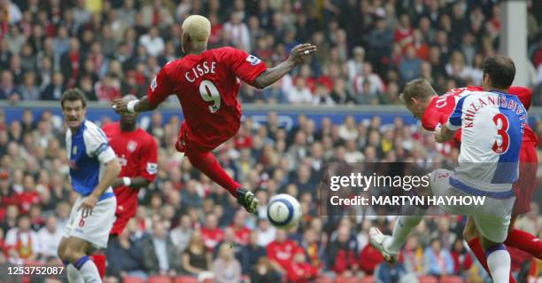 Liverpool's Djibril Cisse tries an overhead kick as colleague Peter Crouch and Blackburn's Zurab Khizanishvili clash in the match at Anfield, 15...