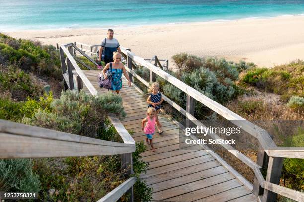 leaving the beach - perth australia stock pictures, royalty-free photos & images