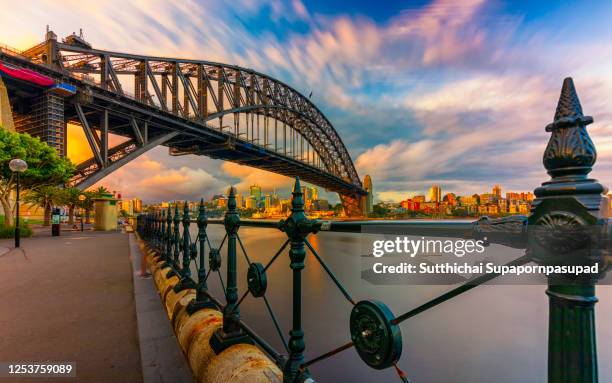 sydney harbour bridge with blue sky. - sydney harbour bridge night stock pictures, royalty-free photos & images