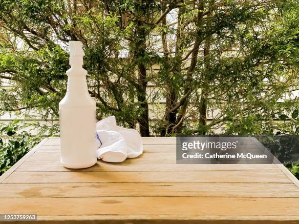 restaurant disinfectant spray and cleaning cloth on counter - restaurant cleaning stock pictures, royalty-free photos & images