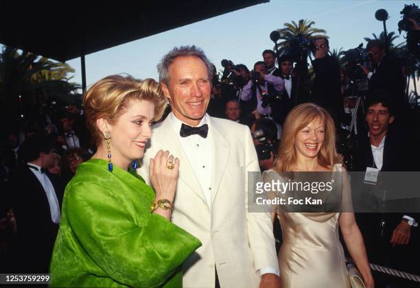 Catherine Deneuve, Clint Eastwood and Frances Fisher as a photographer in the melee fell on the red carpet during the 47th Cannes film Festival in...