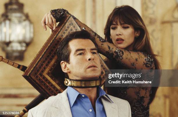 Irish actor Pierce Brosnan stars as 007 opposite French actress Sophie Marceau as Elektra King in the James Bond film 'The World Is Not Enough' 1999....