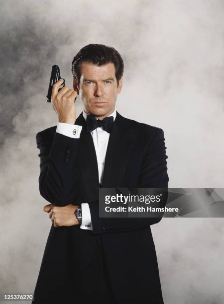 Irish actor Pierce Brosnan stars as 007 in the James Bond film 'Tomorrow Never Dies' 1997 . He is holding his trademark Walther PPK.