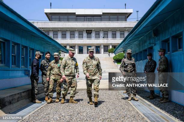 In this photo taken on May 9 US Army Chief of Staff General James McConville walks away from the military demarcation line separating North and South...