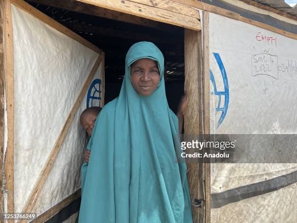 Woman is seen with a baby on her back at the Gwoza IDP Camp in Borno State, Nigeria on May 03, 2023. While the number of people displaced and...