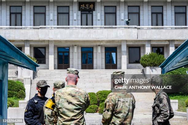 In this photo taken on May 9 US Army Chief of Staff General James McConville stands behind the southern side of the military demarcation line...