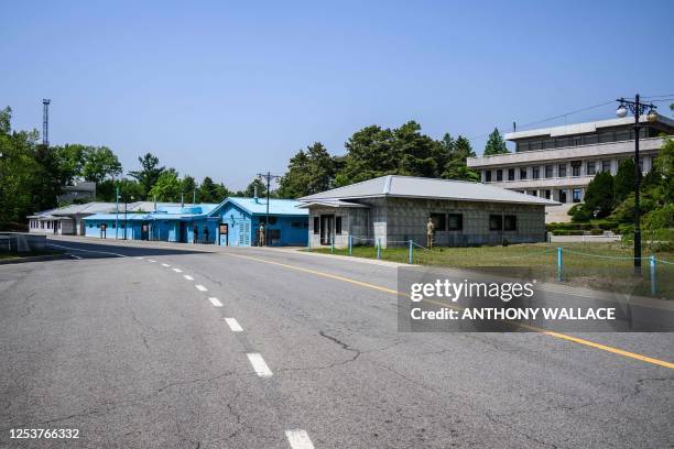 In this photo taken on May 9 a general view shows military personnel standing guard at the truce village of Panmunjom in the Joint Security Area of...