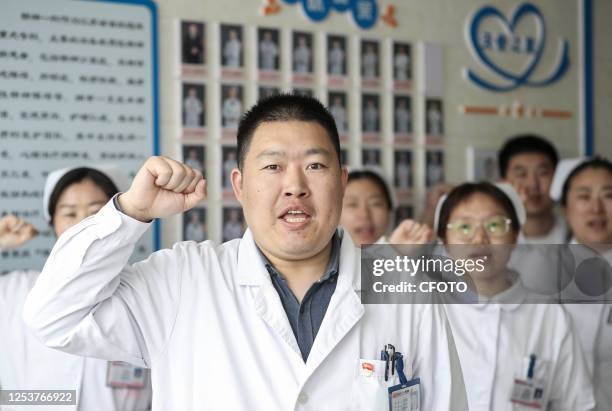 Wang Donghu, head nurse of the psychiatric ward, leads a team of nurses to renew the Nightingale Oath in Huai 'an, Jiangsu province, China, May 11,...