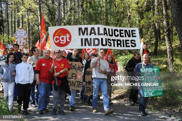 Protestors participate in a demonstration in the southern French village of Malaucene on April 29, 2009 to stop the closure of a paper mill. One of...
