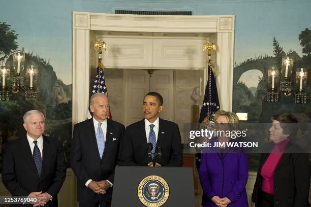 President Barack Obama makes a statement on the Haitian earthquake at the White House in Washington, DC, January 14, 2010 with Secretary of Defense...