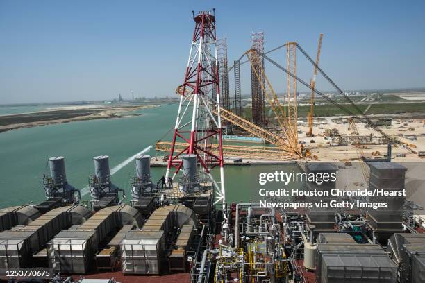 Workers continue construction below the flag tower on Shell's Vito platform at the Kiewit Offshore Services complex Wednesday, April 6, 2022 in...