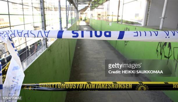 Barrier tape of the Safety Investigation Authority and police block the site of an accident in which around 27 people, a majority of them children,...