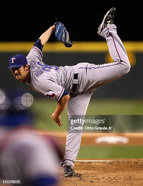 Starting pitcher C.J. Wilson of the Texas Rangers pitches against the Seattle Mariners at Safeco Field on September 16, 2011 in Seattle, Washington.