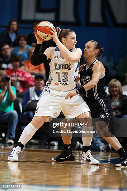 Lindsay Whalen of the Minnesota Lynx looks for the pass against Tully Bevilaqua of the San Antonio Silver Stars in Game One of the Western Conference...