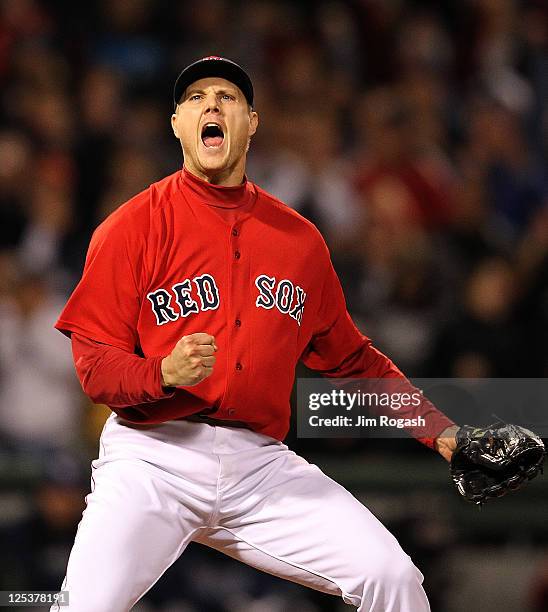 Jonathan Papelbon of the Boston Red Sox reacts after striking out Evan Longoria of the Tampa Bay Rays in the ninth inning to earn a 4-3 win at Fenway...