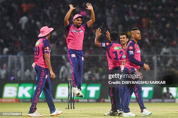 Rajasthan Royals' players celebrate after the dismissal of Kolkata Knight Riders' Andre Russell during the Indian Premier League Twenty20 cricket...