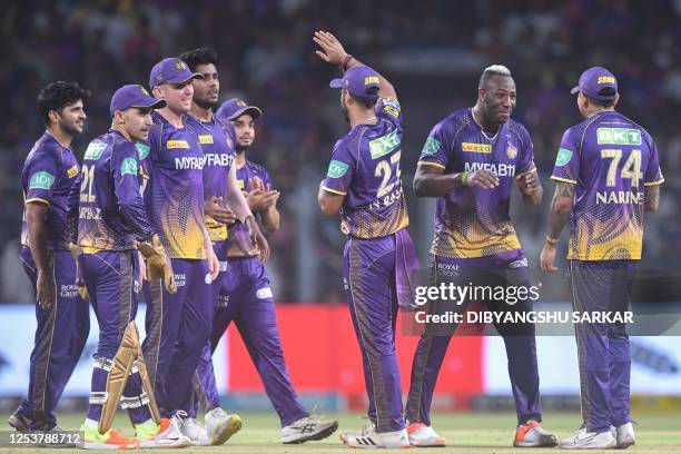 Kolkata Knight Riders' players celebrate after the dismissal of Rajasthan Royals' Jos Buttler during the Indian Premier League Twenty20 cricket match...