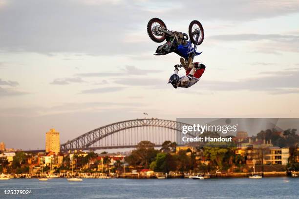 In this handout image provided by Global Newsroom, Eigo Sato of Japan performs during the qualifying for the last stage of the Red Bull X-Fighters...