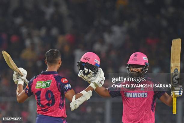 Rajasthan Royals' Yashasvi Jaiswal and Sanju Samson celebrate after winning the Indian Premier League Twenty20 cricket match between Kolkata Knight...