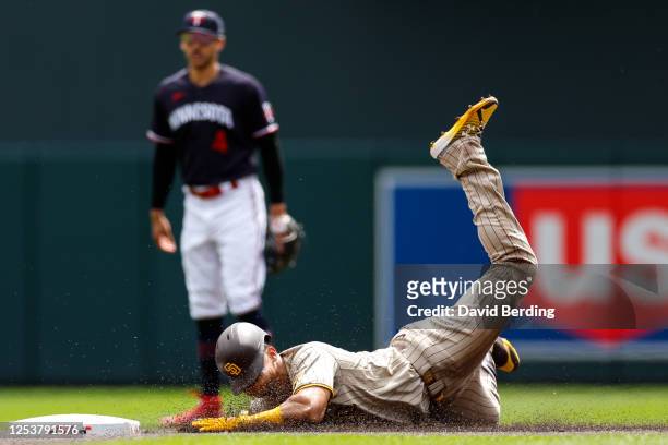 Juan Soto of the San Diego Padres slides into second base on his double against the Minnesota Twins in the first inning at Target Field on May 11,...