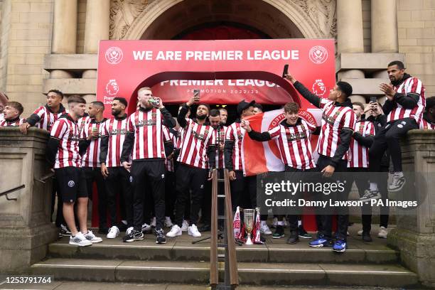 Sheffield United players during celebrations at Sheffield Town Hall. Sheffield United secured promotion back to the Premier League after finishing...