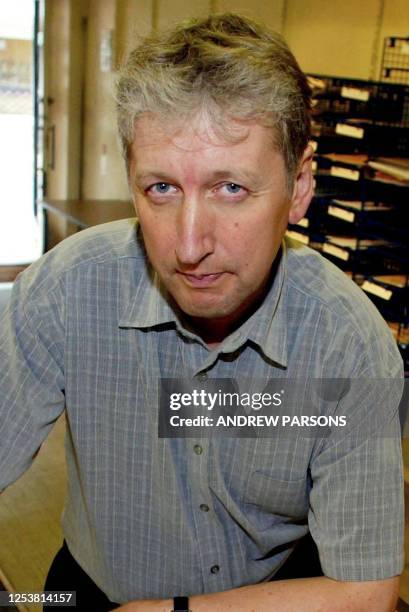 Principal Howard Gilbert of Soham Village College is seen 27 August 2002 in his temporary office, which has just opened in the High Street of Soham,...