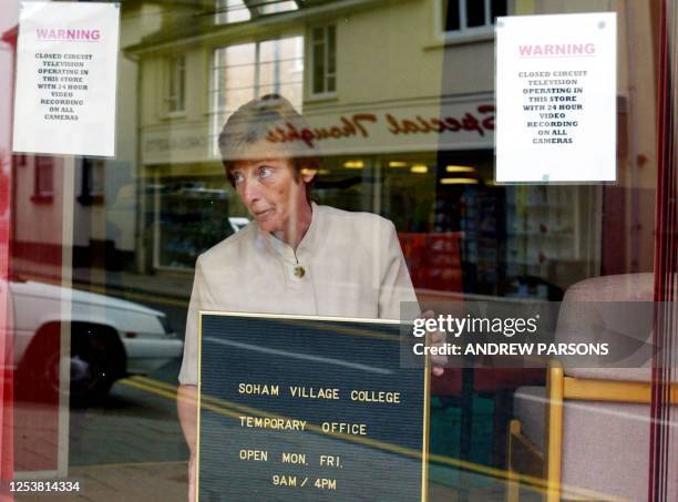 The vice principal of Soham Village College, Margaret Bryden, puts up a temporary office sign 27 August 2002, which has just opened in the High...