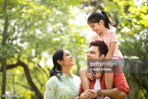 happy family at park - indian family stock pictures, royalty-free photos & images