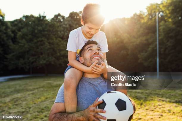 we are always happy when  spending time together - father and son park stock pictures, royalty-free photos & images