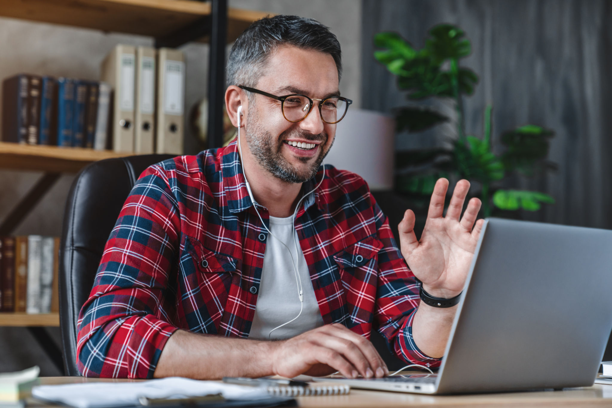 Male remote working from home and having work confrence video call Male remote working from home and having work confrence video call