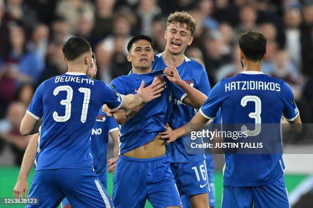 Alkmaar's Dutch midfielder Tijjani Reijnders celebrates with teammates after scoring the opening goal of the UEFA Europa Conference League semi-final...