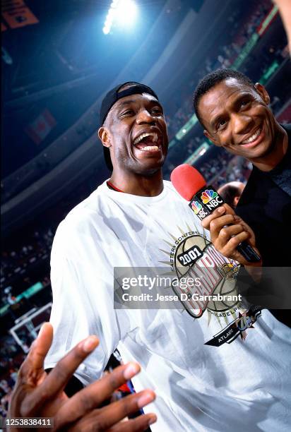 Dikembe Mutombo of the Philadelphia 76ers celebrates after the game against the Milwaukee Bucks in Game seven of the 2001 Eastern Conference Finals...